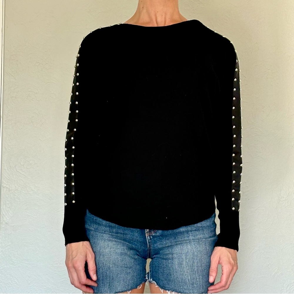 Black, versatile, pearl-studded sweater… sexy, chic, party, and professional!